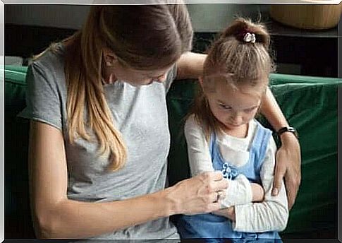 A woman trying to talk to an angry child