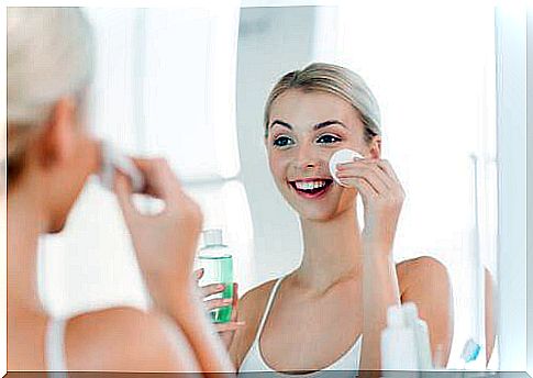 Woman applies toner to ensure clean and even skin