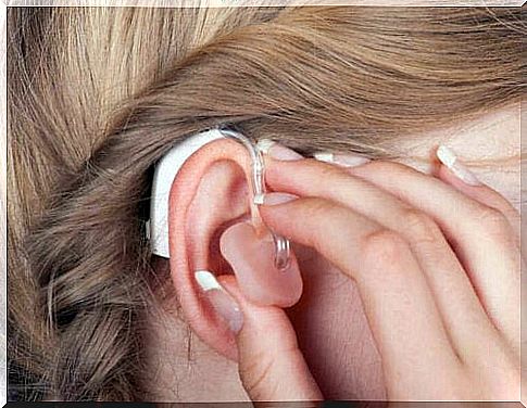 A woman with a hearing aid in her ear