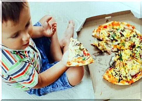 A child eating pizza.