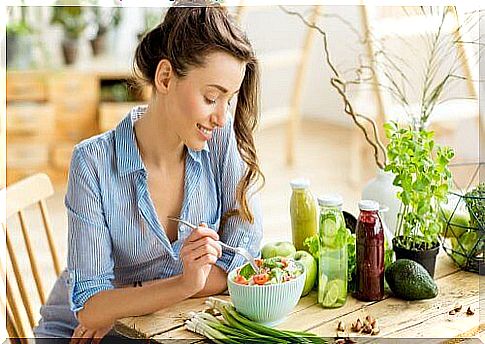 Woman eating salad