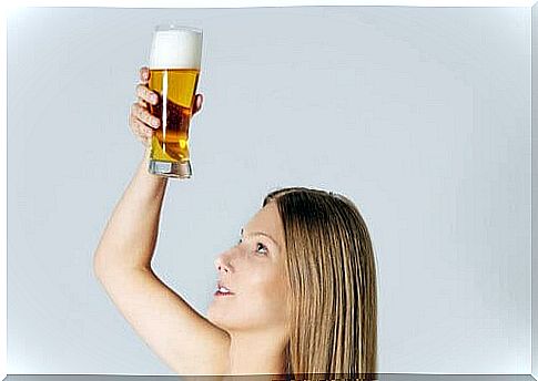 A lady with a pint of beer as a natural hair mask