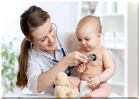 A doctor examining a child.