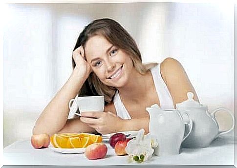 Healthy woman eats fruit